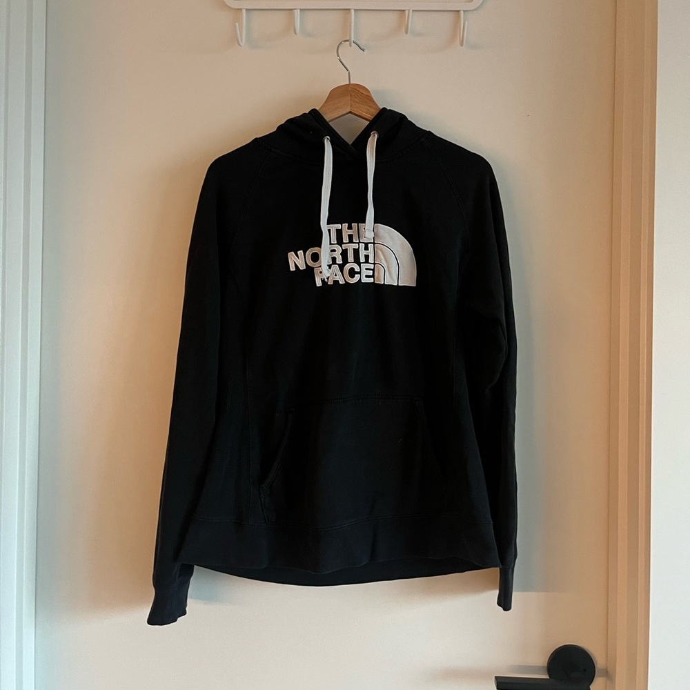 Black and white women’s north face hoodie